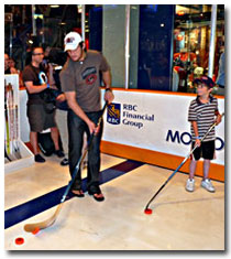 NHL star Alexander Ovechkin tests his skills in the Pro Hockey Life Shoot Out game.
