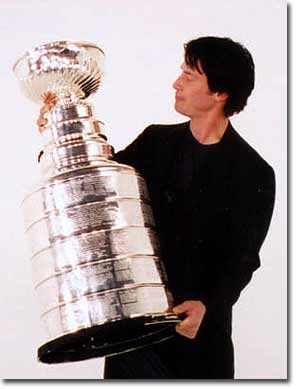 Whoa! Keanu Reeves holds the Stanley Cup.