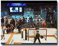 Participants line up for a turn at the free interactive games Pro Hockey Life Shoot Out and Pepsi Shut Out at the Hockey Hall of Fame