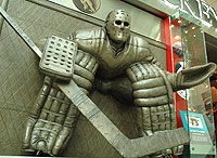 The larger-than-life statue honouring Ken Danby's 'At The Crease' painting outside the Spirit of Hockey Store.