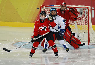 Game action between Canada and Finland at the 2006 Olympic Winter Games in Turin, Italy.