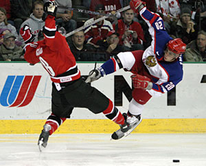 Canada's Mike Richards collides with Russia's Alexei Emelin during gold medal game action at the 2005 World Junior Championship in Fargo, North Dakota.