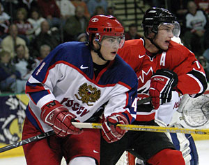 Canada's Jeff Carter battles with Russia's Dmitri Megalinski during gold medal game action at the 2005 World Junior Championship in Fargo, North Dakota.