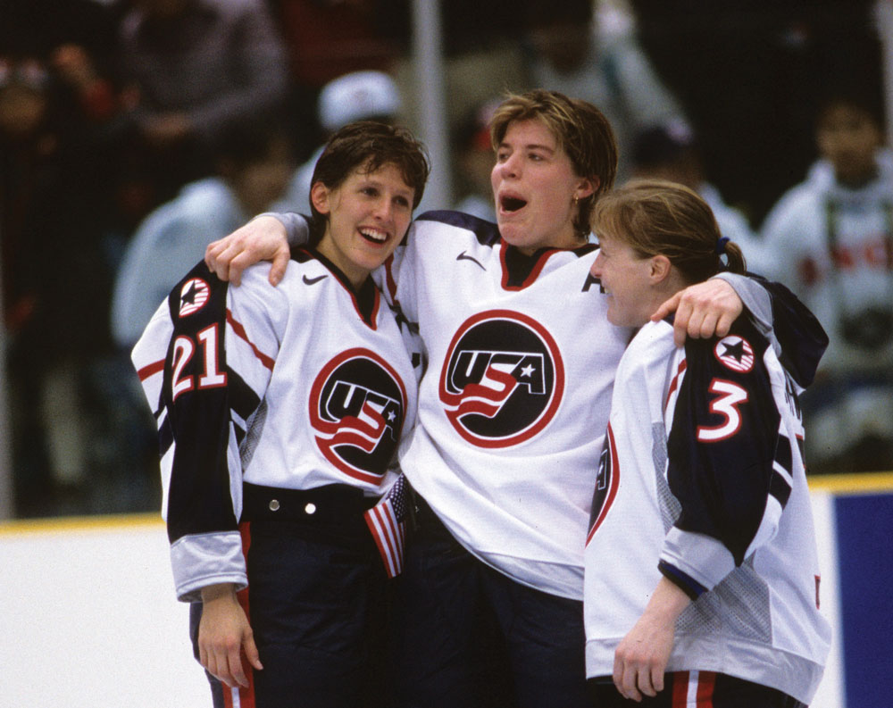 Cammi Granato, Karyn Bye and Lisa Brown-Miller celebrate the USA winning the first gold medal for women’s hockey at the Olympic Winter Games.